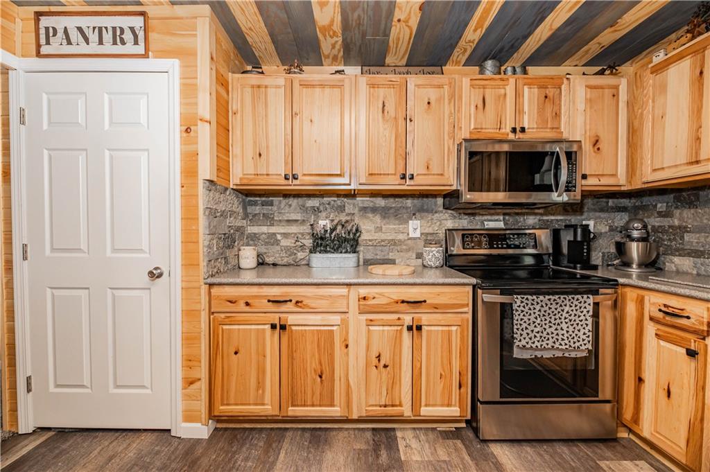 280 Chestnut Road Penn Run, PA 15765 - Photo 10 of 25 a kitchen with stainless steel appliances granite countertop a stove a sink and a microwave