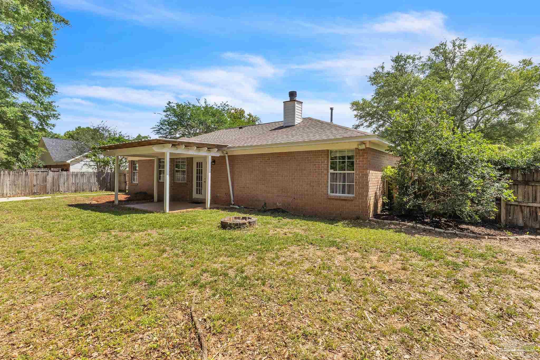 4321 Ridgeland Drive Pace, FL 32571 - Photo 32 of 36 a house view with a garden space