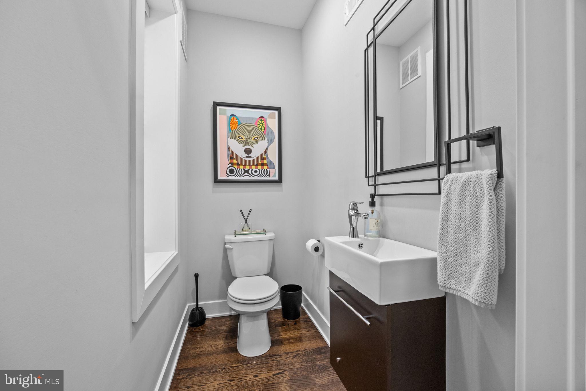 450 Ripka Street Philadelphia, PA 19128 - Photo 14 of 47 a bathroom with a toilet sink and mirror