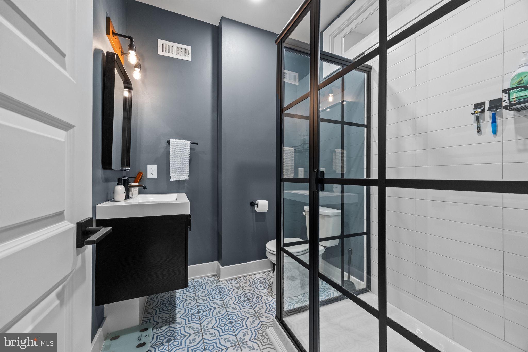 450 Ripka Street Philadelphia, PA 19128 - Photo 25 of 47 a bathroom with a sink and a mirror