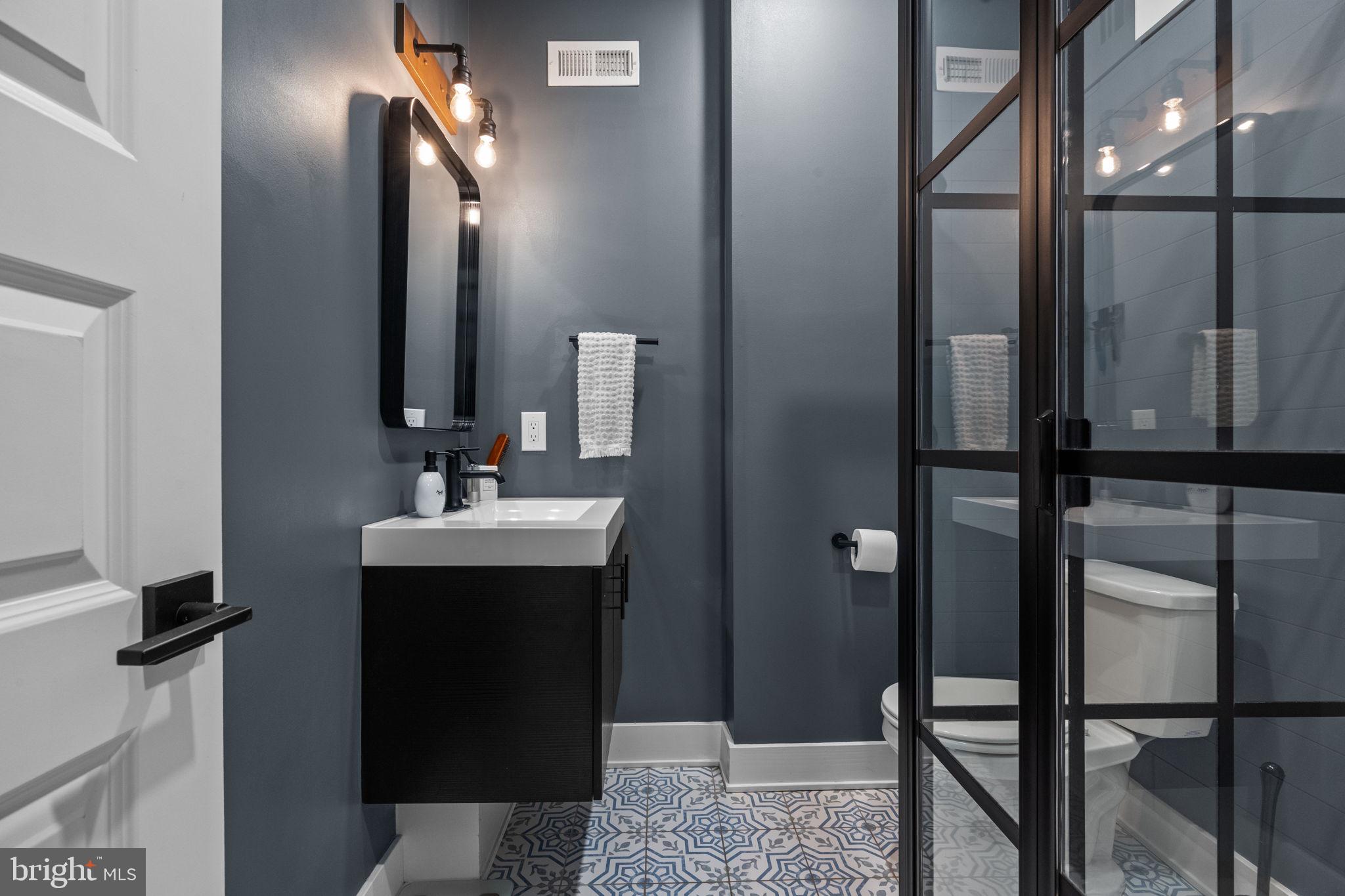 450 Ripka Street Philadelphia, PA 19128 - Photo 26 of 47 a bathroom with a sink and a mirror