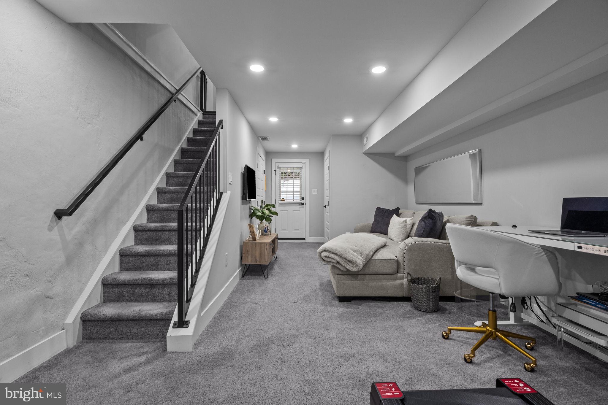 450 Ripka Street Philadelphia, PA 19128 - Photo 29 of 47 a living room with furniture and stairs