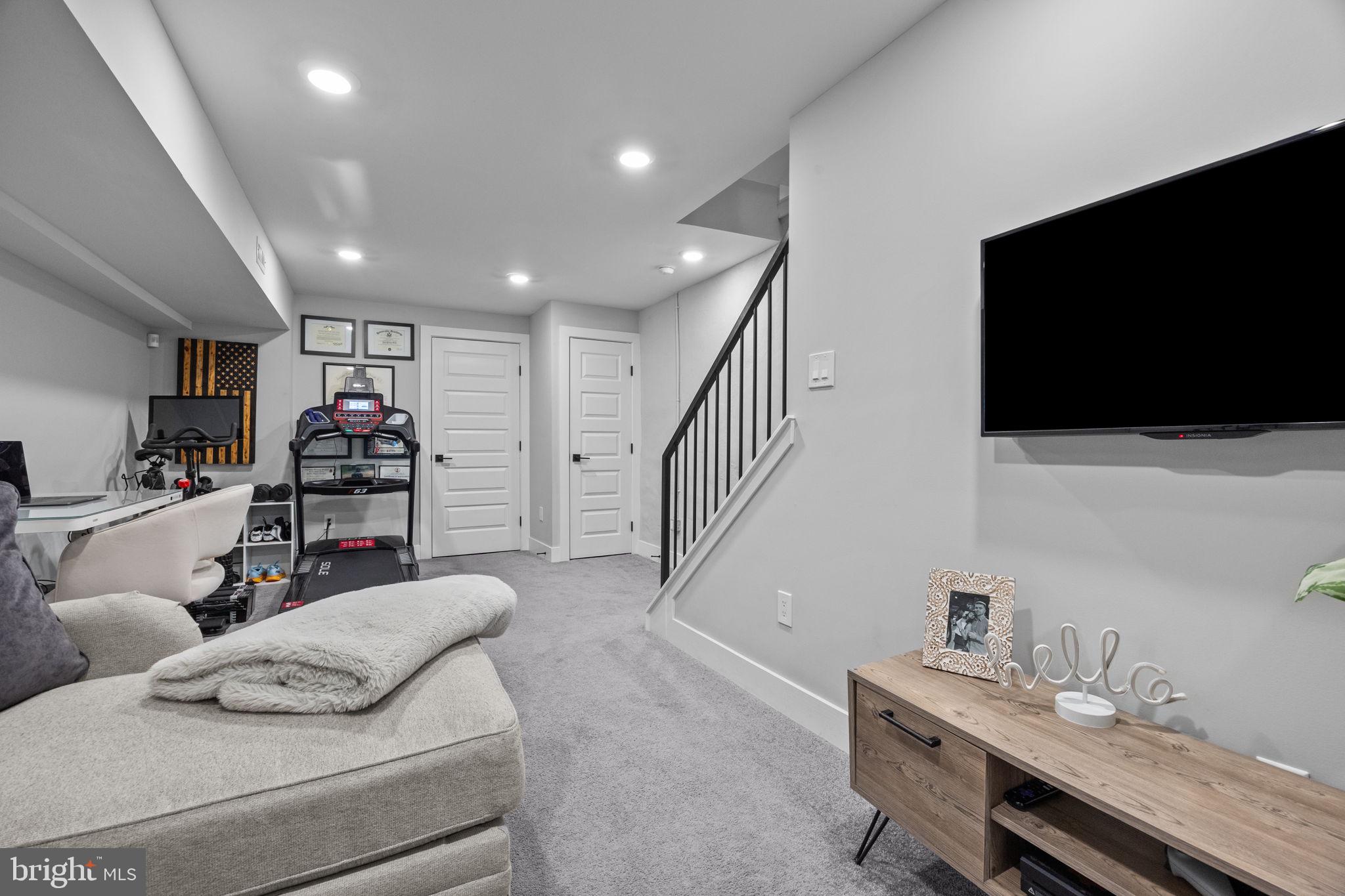 450 Ripka Street Philadelphia, PA 19128 - Photo 30 of 47 a living room with furniture and a flat screen tv