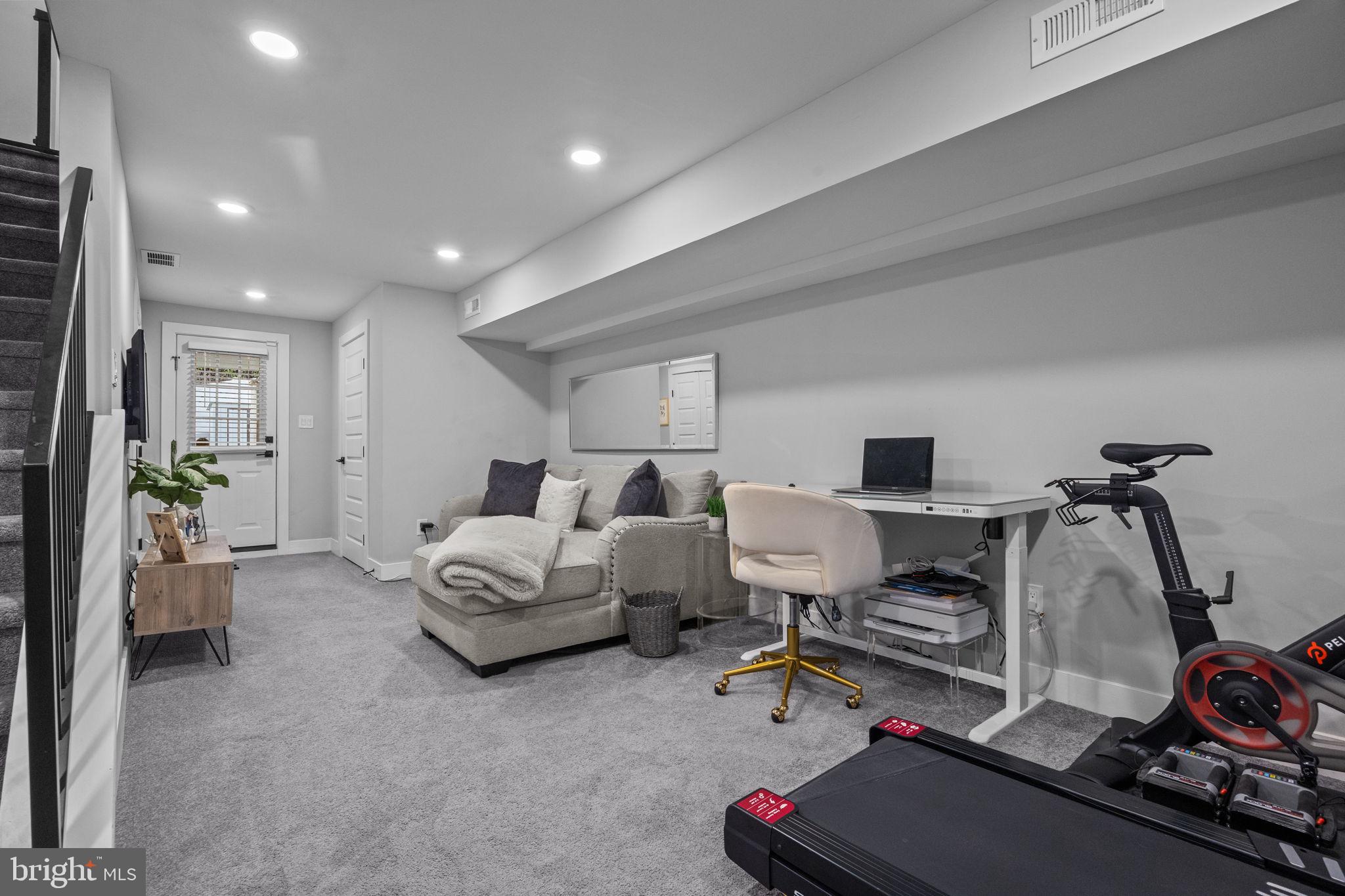 450 Ripka Street Philadelphia, PA 19128 - Photo 31 of 47 a living room with furniture a flat screen tv and a couch