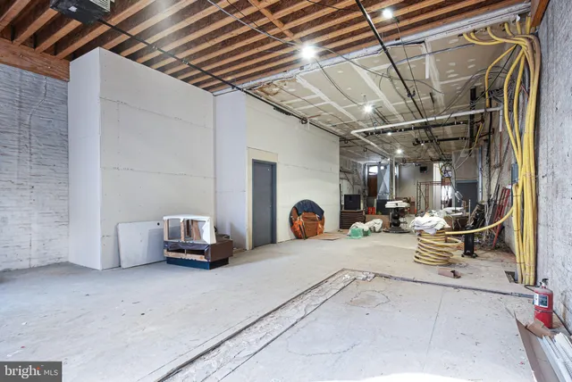 a view of living room filled with furniture and a garage