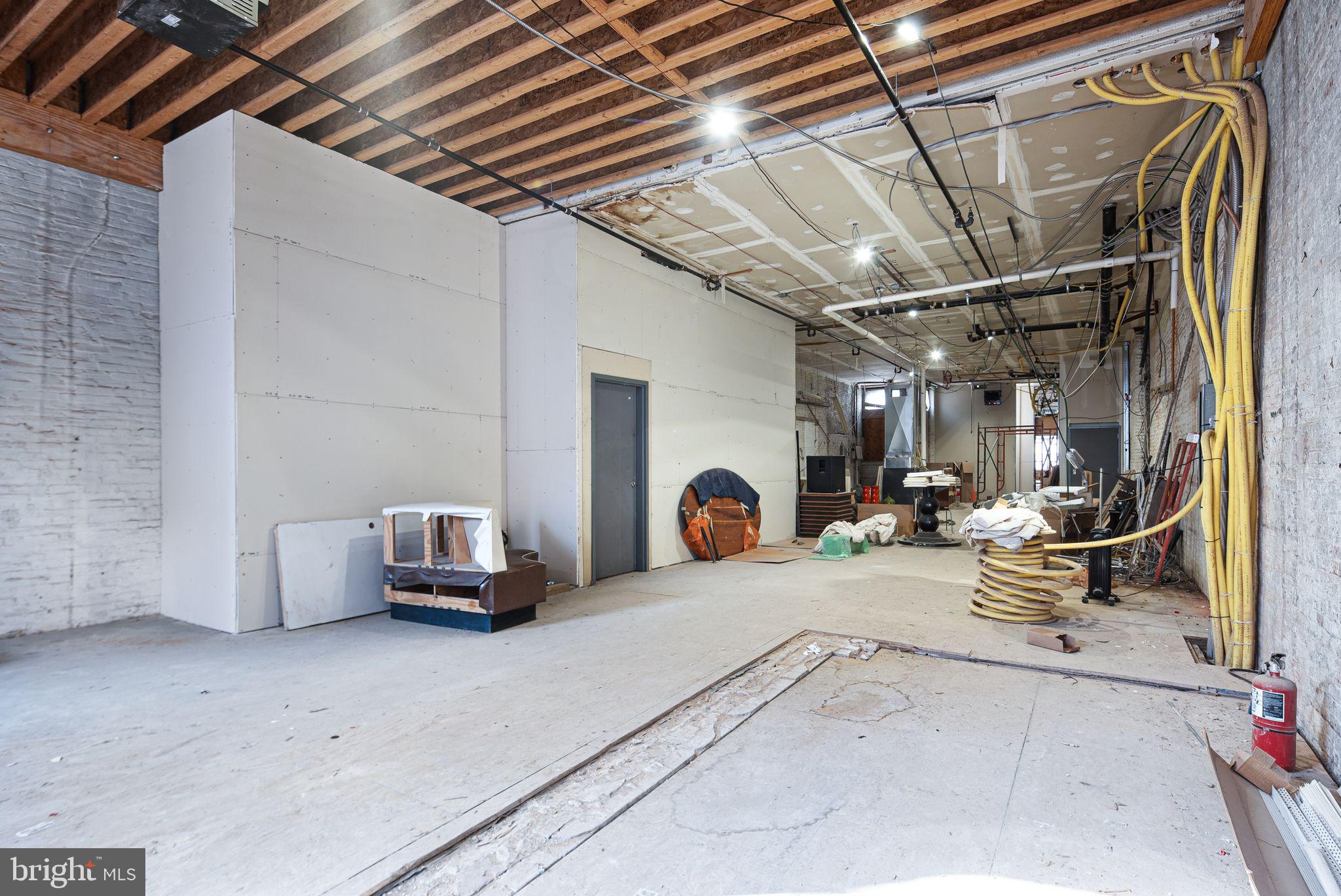 20 Letitia Street, Unit 2C Philadelphia, PA 19106 - Photo 4 of 9 a view of living room filled with furniture and a garage