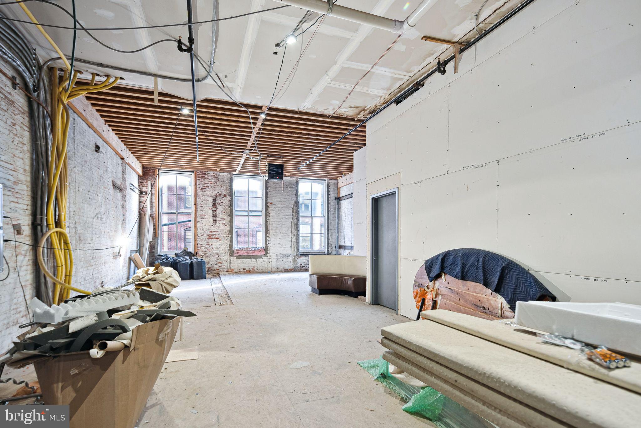 20 Letitia Street, Unit 2C Philadelphia, PA 19106 - Photo 5 of 9 a bedroom with furniture and a large window