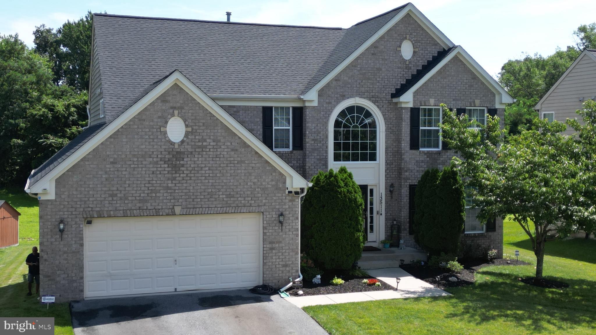 13511 Bermingham Manor Drive Laurel, MD 20708 - Photo 2 of 51 a front view of a house with a yard