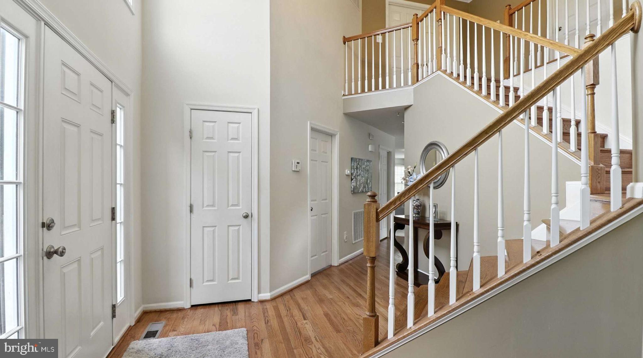 13511 Bermingham Manor Drive Laurel, MD 20708 - Photo 3 of 51 a view of entryway with wooden floor and stairs