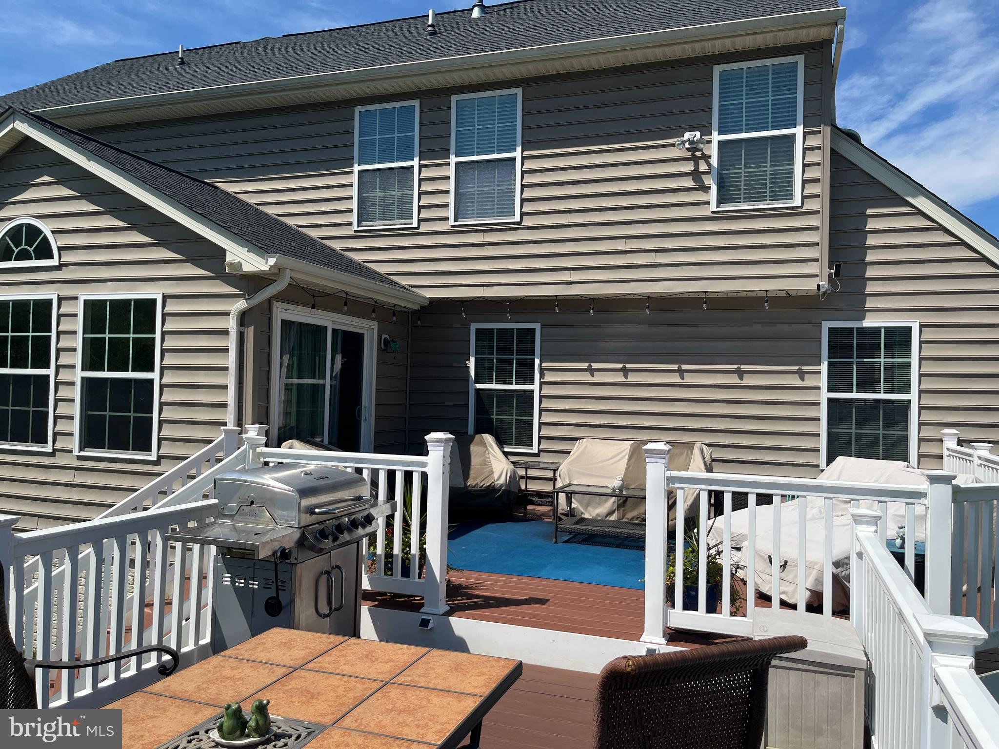 13511 Bermingham Manor Drive Laurel, MD 20708 - Photo 42 of 51 a view of a patio with a table and chairs