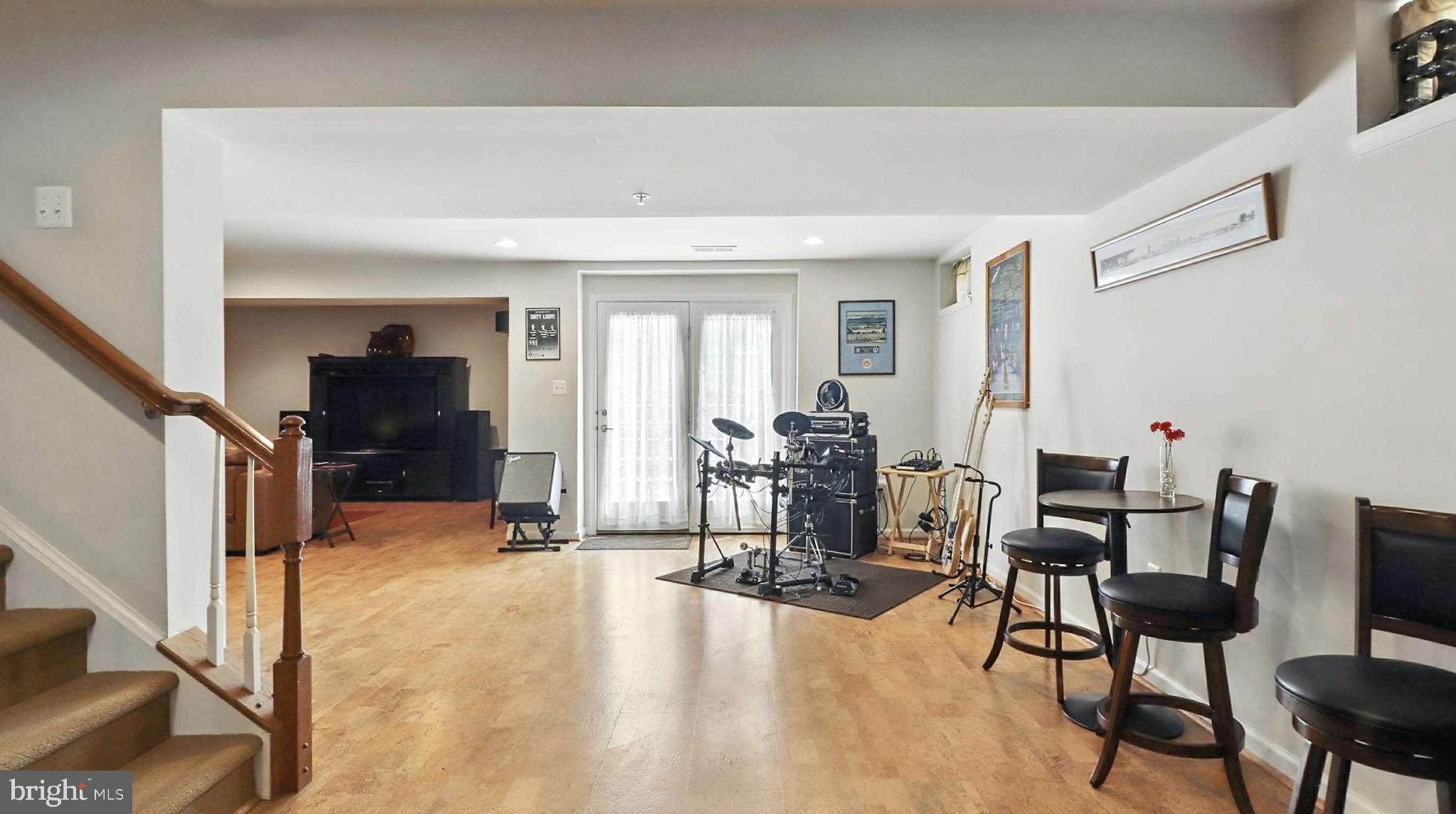 13511 Bermingham Manor Drive Laurel, MD 20708 - Photo 50 of 51 a view of a livingroom with furniture and a flat screen tv