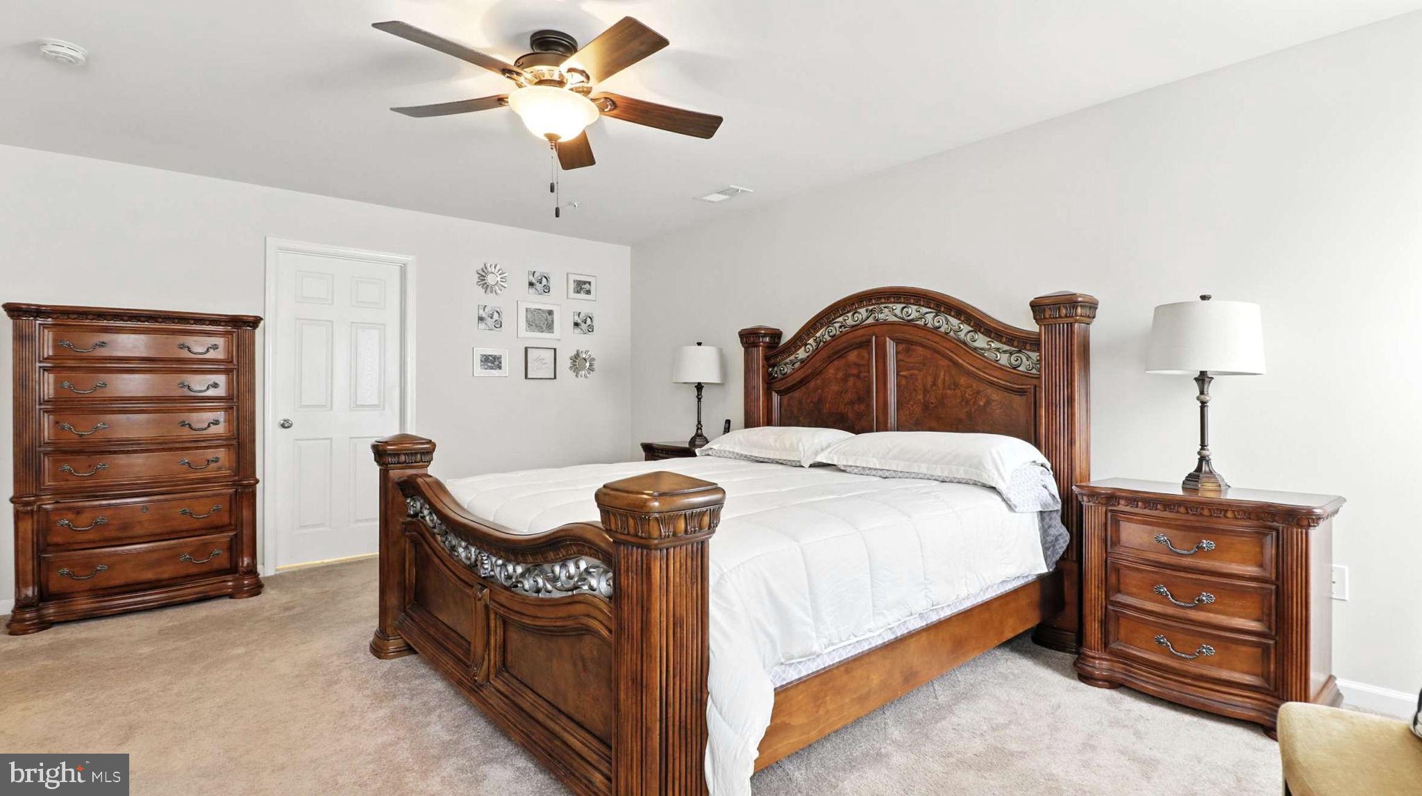 13511 Bermingham Manor Drive Laurel, MD 20708 - Photo 8 of 51 a bedroom with a bed and a dresser