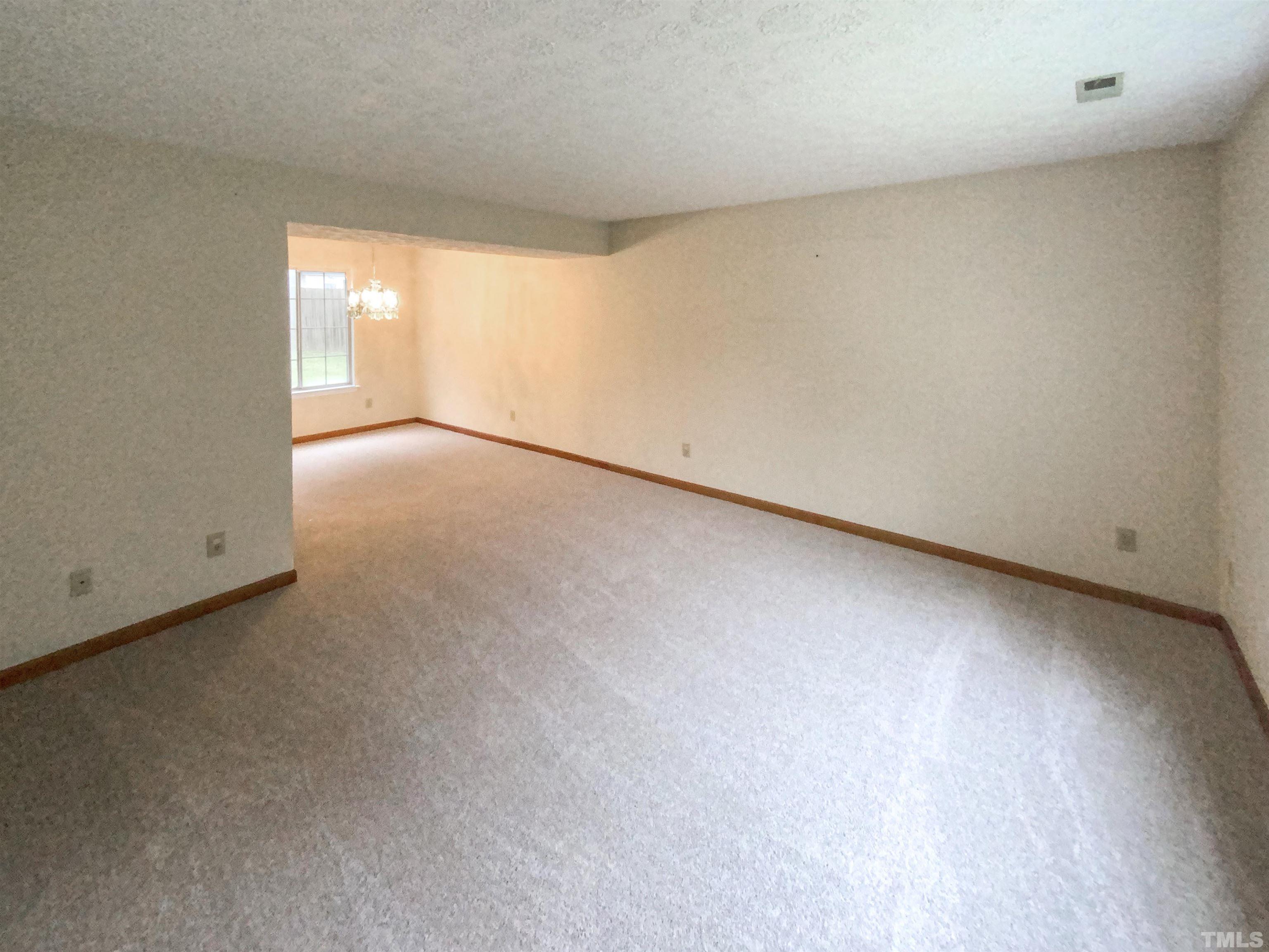 6509 Hammersmith Drive Raleigh, NC 27613 - Photo 8 of 20 a view of an empty room and window