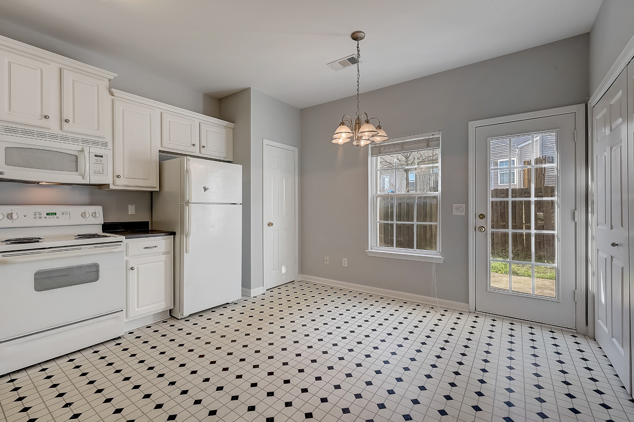 1101 Downs Boulevard, Unit 80 Franklin, TN 37064 - Photo 6 of 19 a kitchen with a refrigerator and cabinets