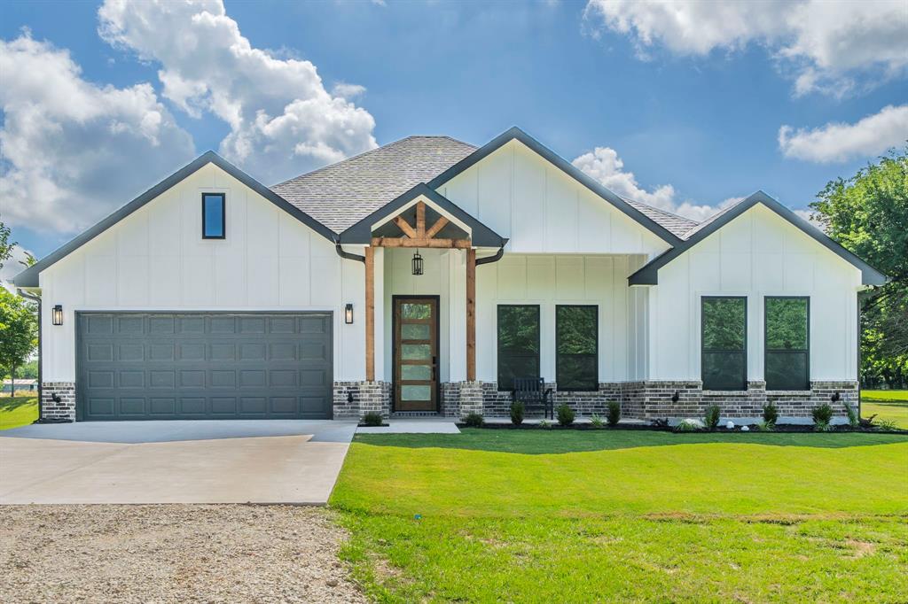 501 South Main Street Ector, TX 75439 - Photo 1 of 1 a view of pool with lawn chairs and plants