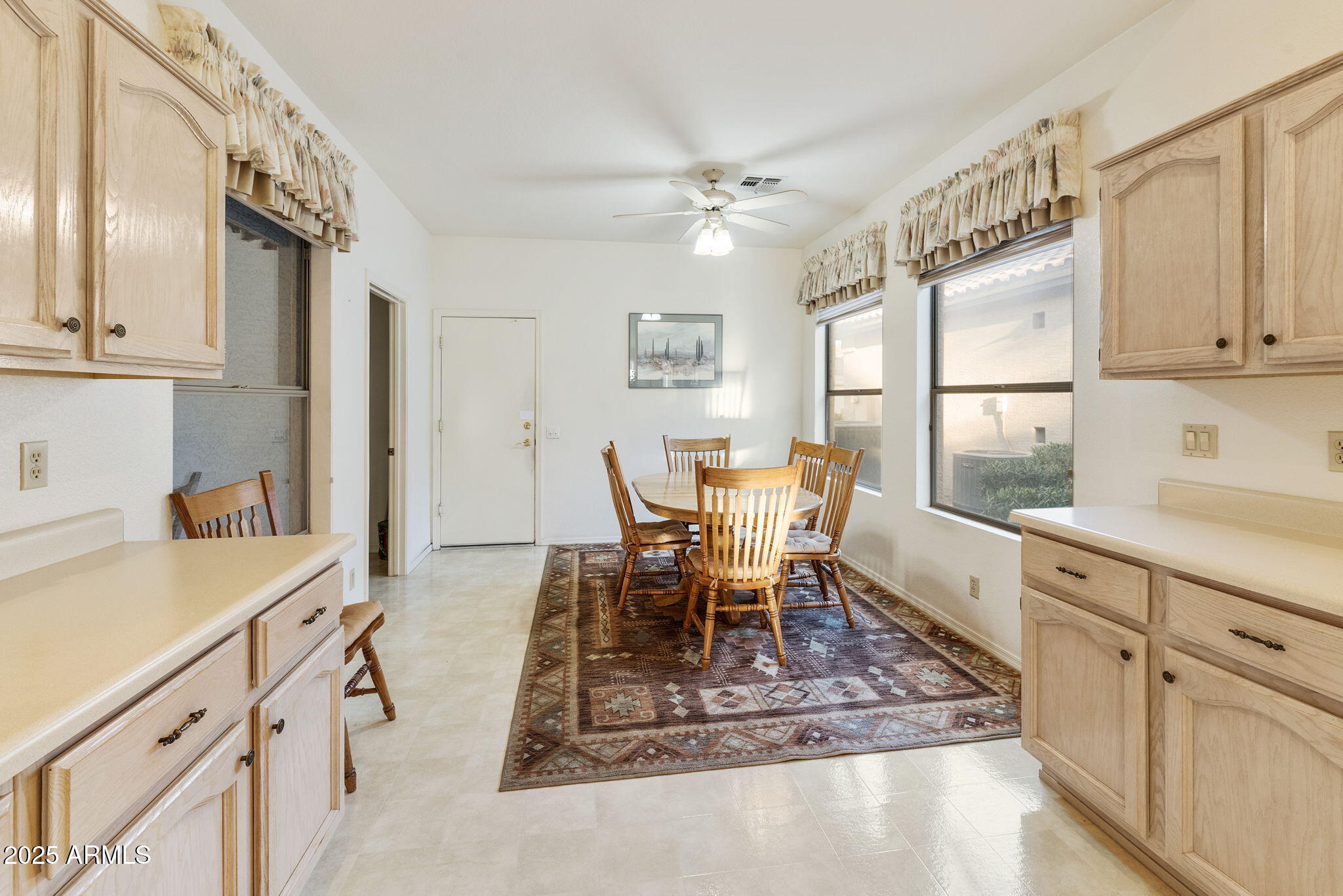 23729 South Pleasant Way, Unit 37 Sun Lakes, AZ 85248 - Photo 10 of 55 a dining room with wooden floor and a window