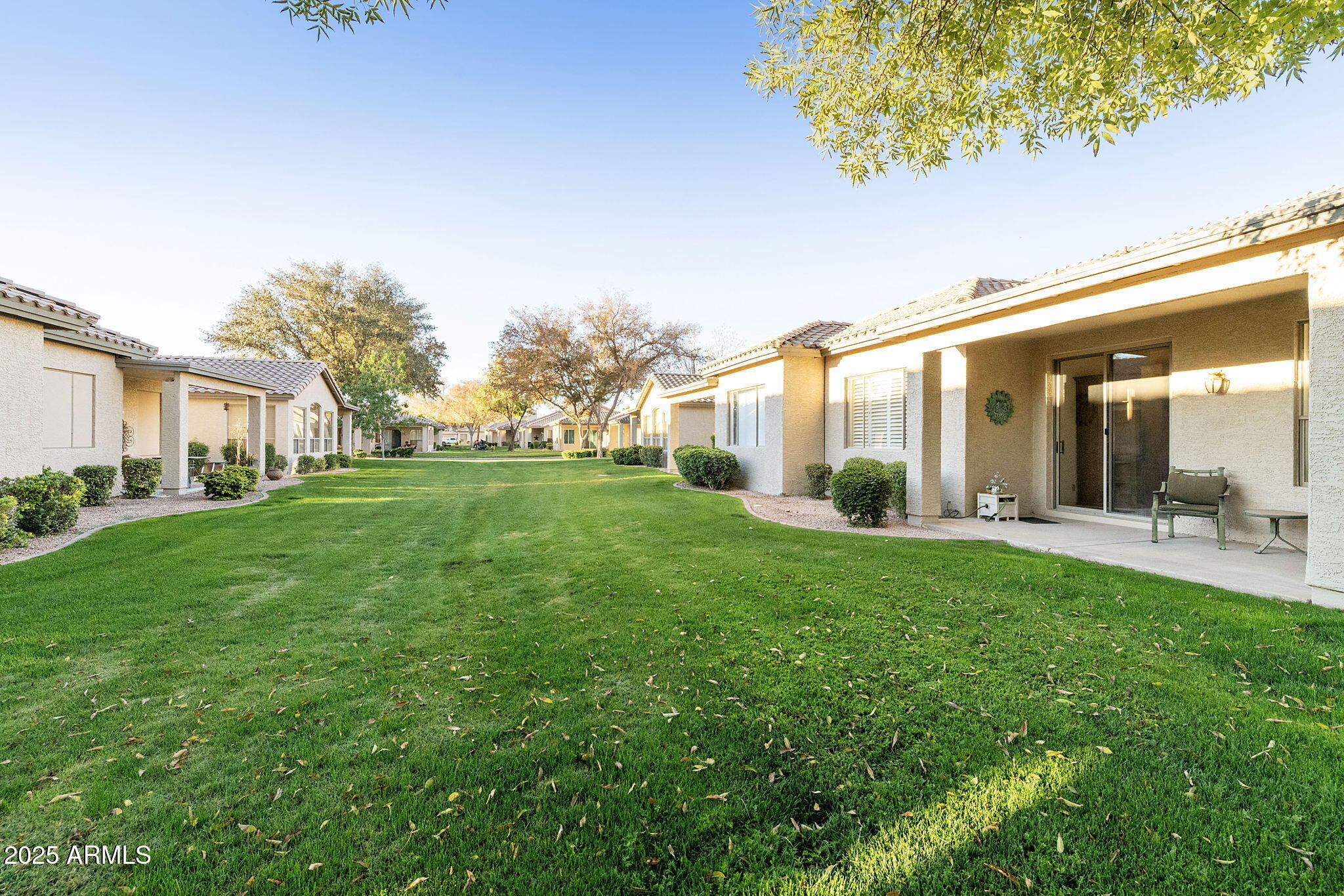 23729 South Pleasant Way, Unit 37 Sun Lakes, AZ 85248 - Photo 25 of 55 a view of a house with backyard porch and garden