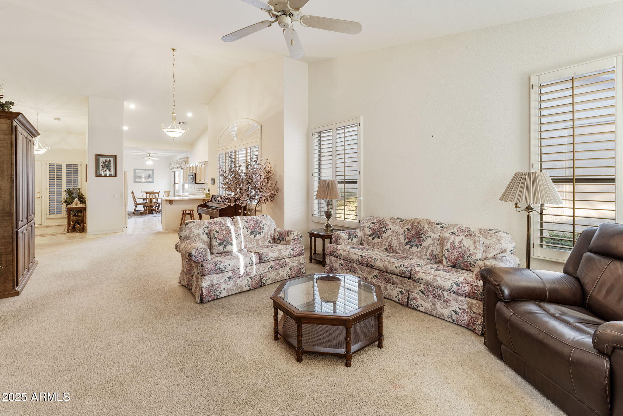 23729 South Pleasant Way, Unit 37 Sun Lakes, AZ 85248 - Photo 7 of 55 a living room with furniture and a large window