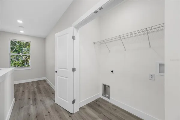 a view of entryway with wooden floor