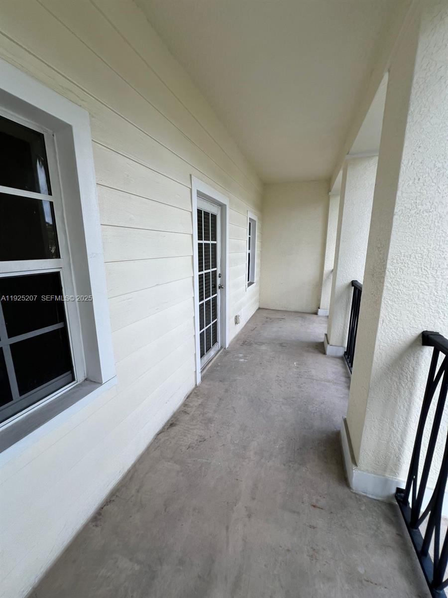 22 Southwest 6th Court, Unit 22 Pompano Beach, FL 33060 - Photo 19 of 26 wooden floor in an empty room