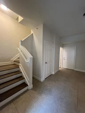 a view of a livingroom with a staircase