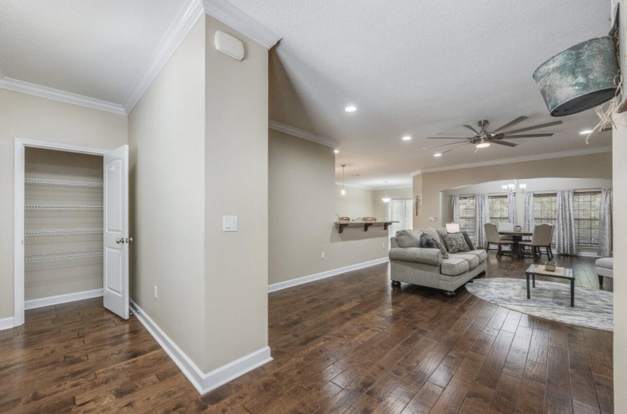 6075 Carina Road Crestview, FL 32539 - Photo 5 of 52 a living room with furniture and a wooden floor