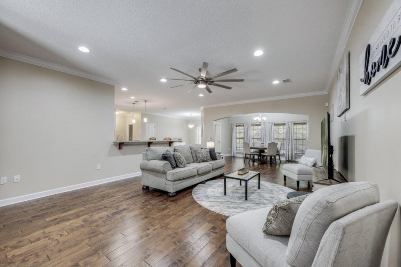 6075 Carina Road Crestview, FL 32539 - Photo 9 of 52 a living room with furniture and a ceiling fan