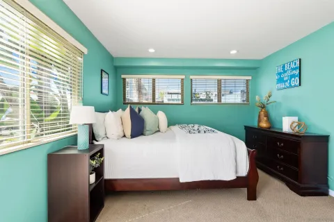 a bedroom with a bed and window