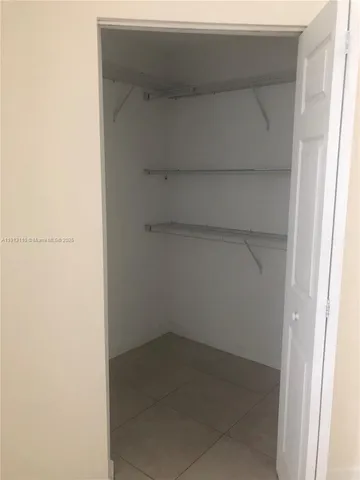 a empty closet with white paint