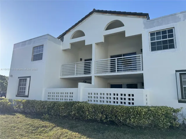 a view of a wooden door and a yard