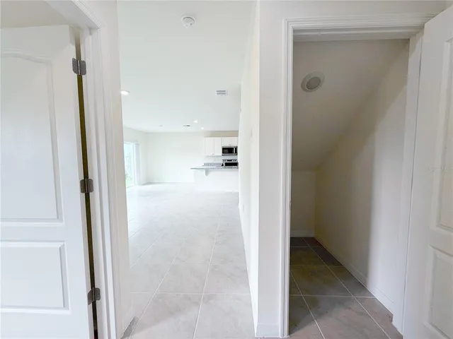 a view of an empty room with a window