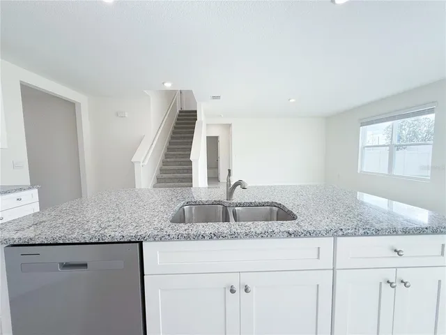 a view of a kitchen with appliances and cabinets
