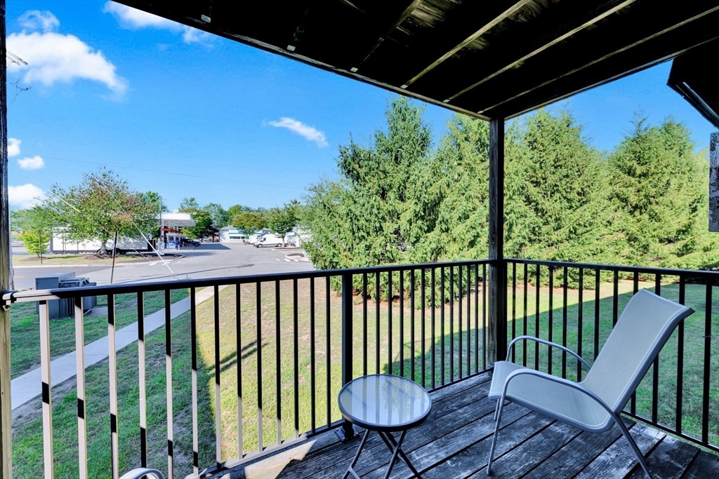 688 Boston Post Road East, Unit 228 Marlborough, MA 01752 - Photo 17 of 22 a view of a two chair in the balcony
