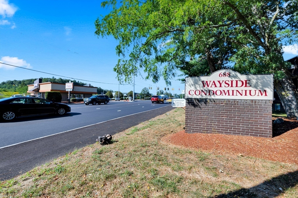 688 Boston Post Road East, Unit 228 Marlborough, MA 01752 - Photo 21 of 22 a sign that is on the side of the road