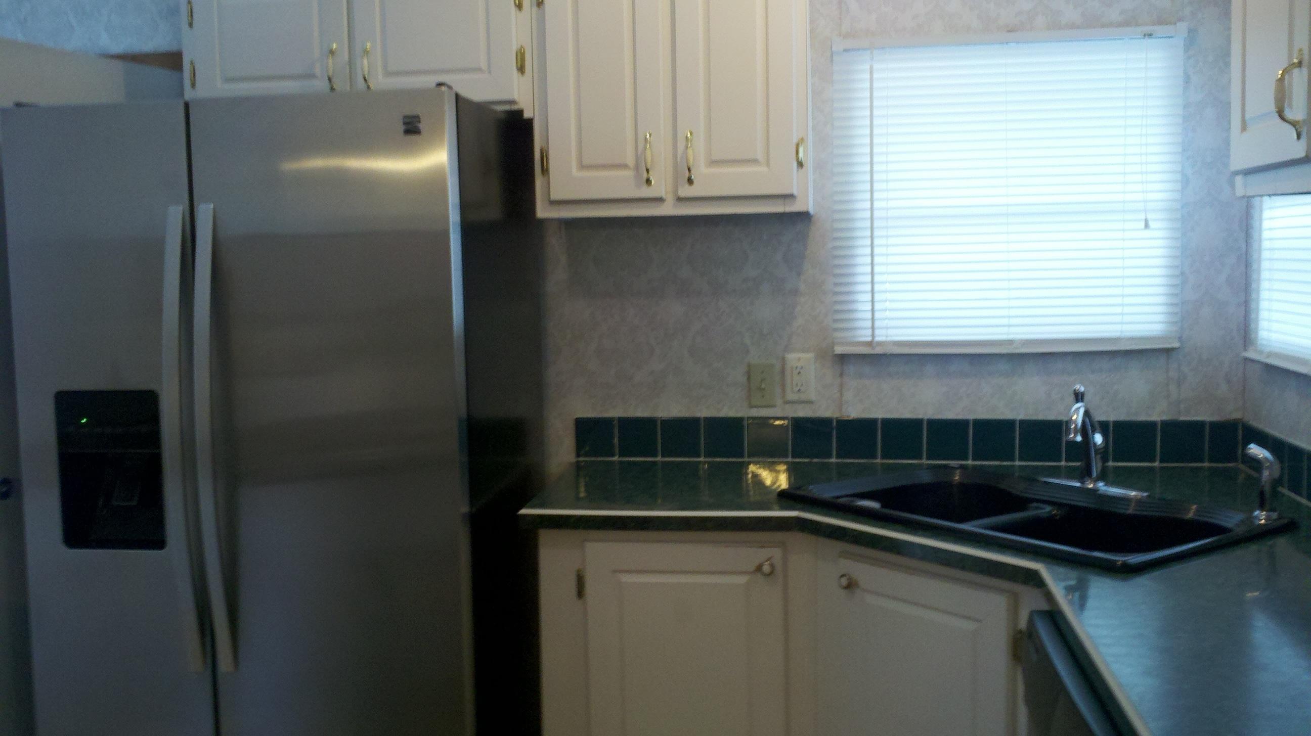 70 Hummingbird Lane Freeport, FL 32439 - Photo 8 of 19 White Kitchen with S/S applainces