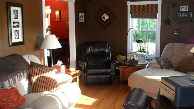 4 Chandler Road Lawrenceburg, TN 38464 - Photo 14 of 20 a living room with furniture and a lamp