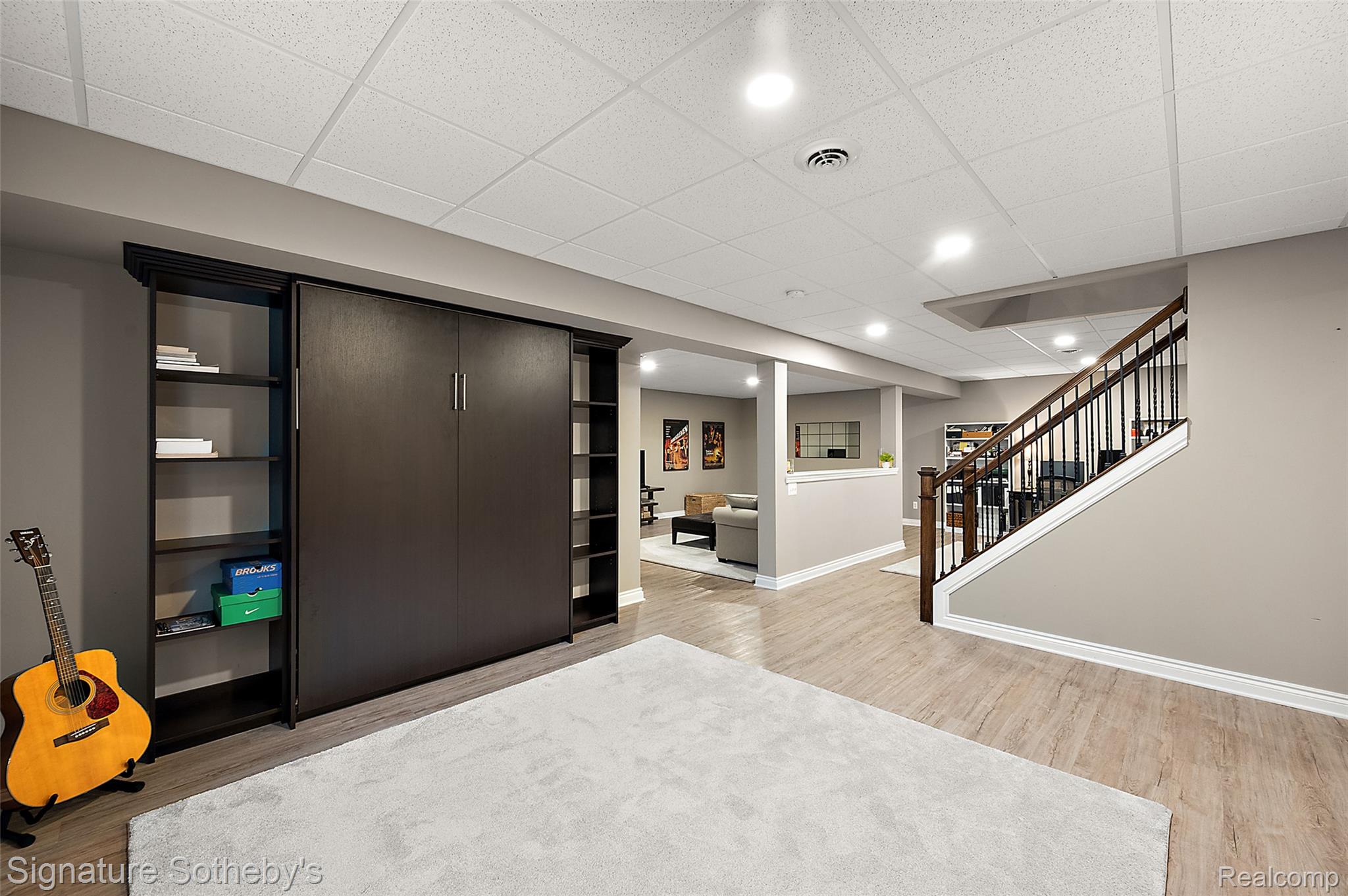 1075 Hampshire Court Rochester, MI 48307 - Photo 23 of 29 Basement is beautifully finished with space for family room, office, and bedroom