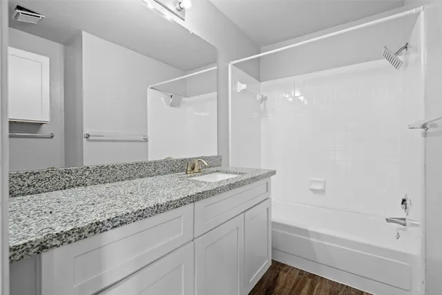 a view of a wooden deck next to a yard