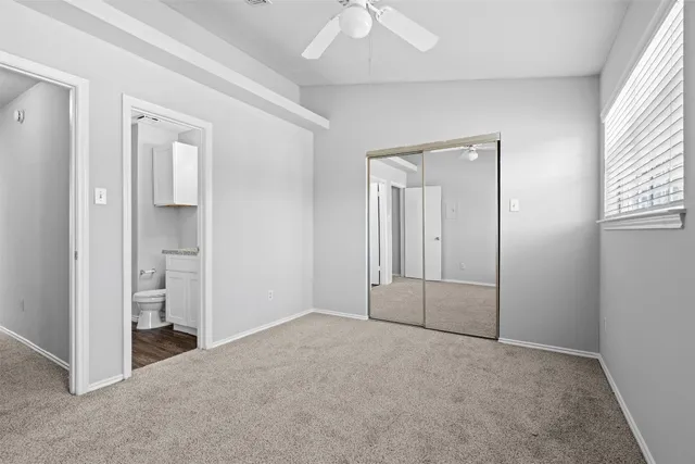 a city view from a balcony with outdoor seating