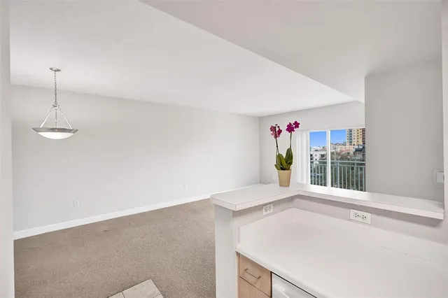 a view of a kitchen with a sink and dishwasher