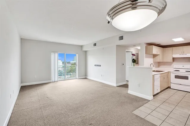 a view of a kitchen with a sink and a stove