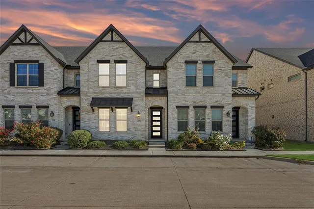 front view of brick house with a street