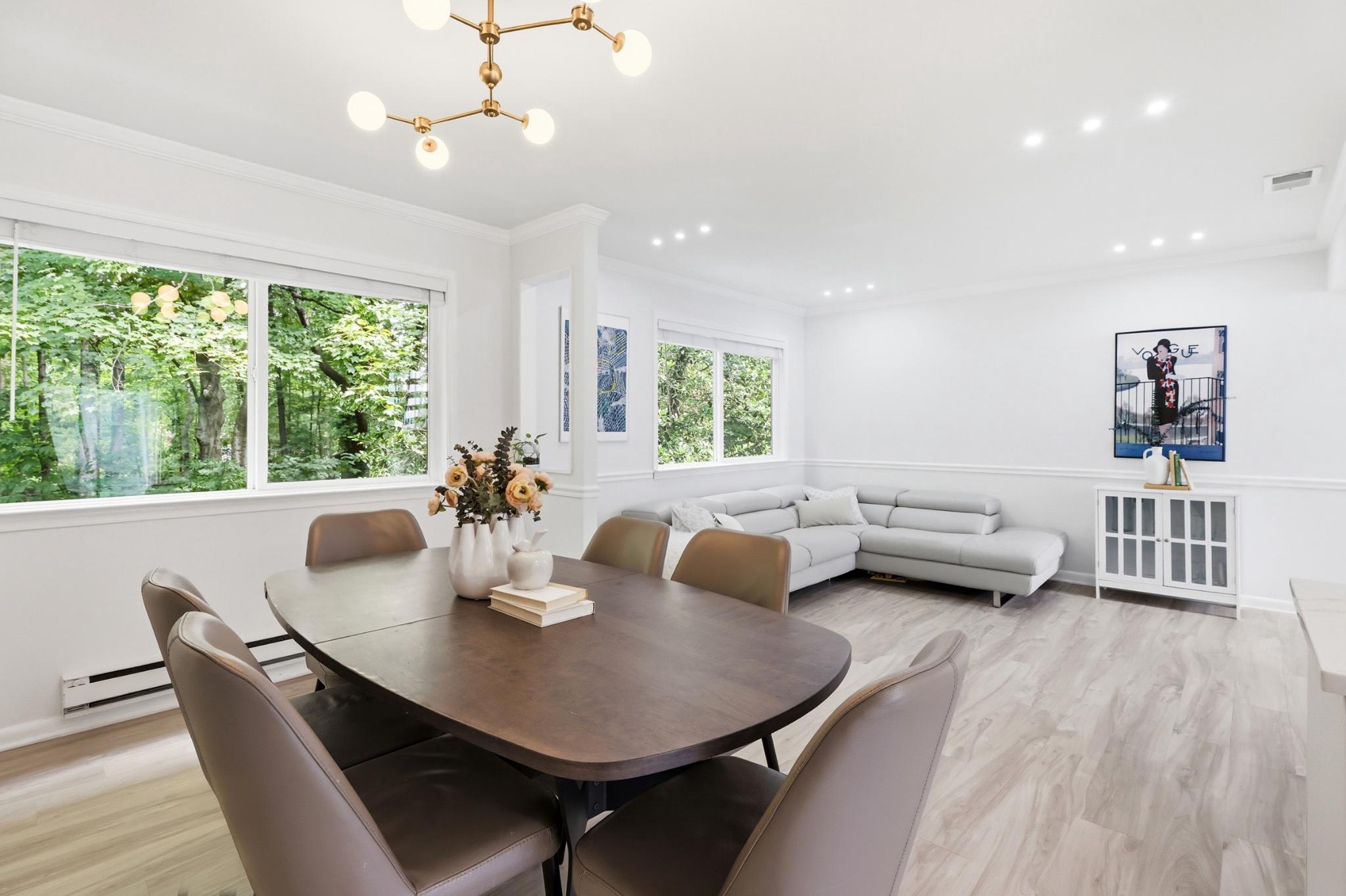 2260 Covent Gardens Court Reston, VA 20191 - Photo 10 of 42 Sun-filled living room with tree-lined views