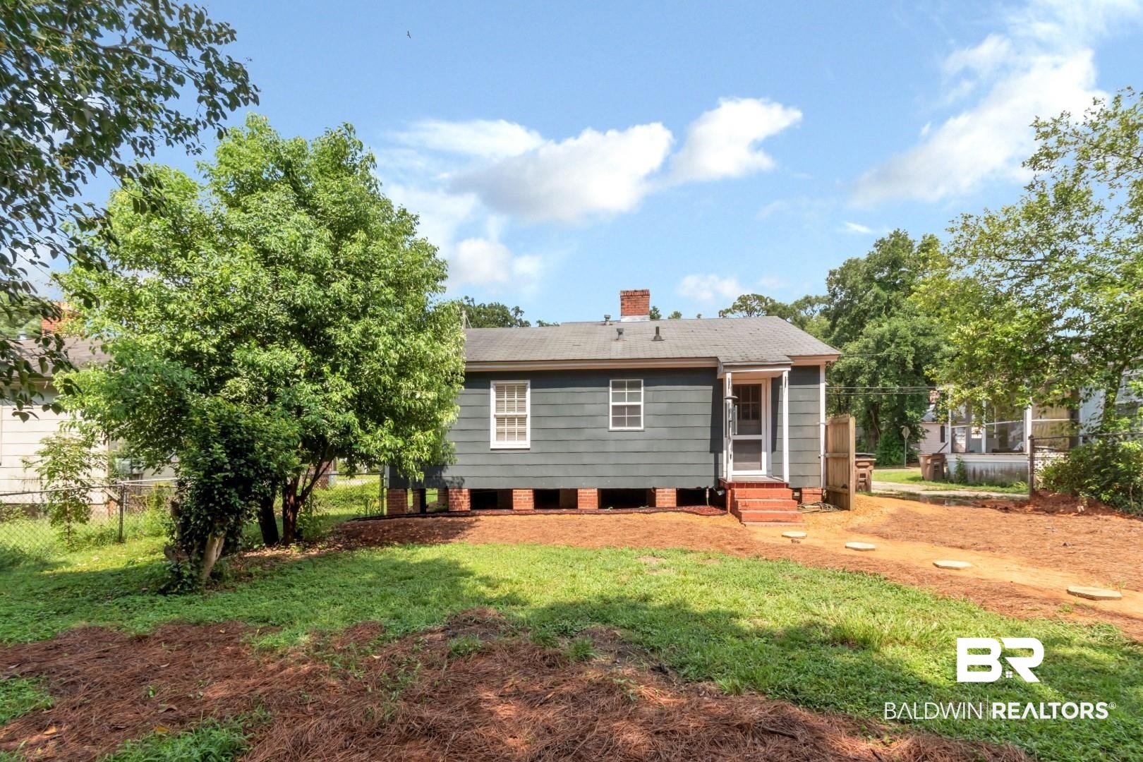 212 Morgan Avenue Mobile, AL 36606 - Photo 14 of 15 Back of house featuring a yard