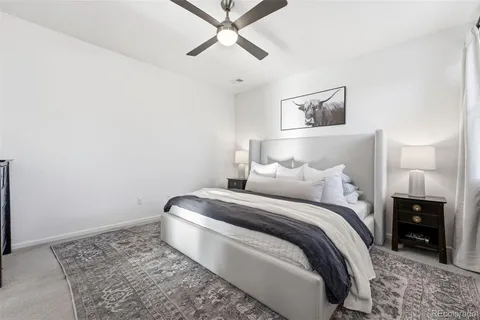 a bedroom with a bed and a tv