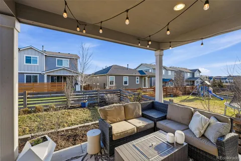 a view of a patio with couches chairs and a table