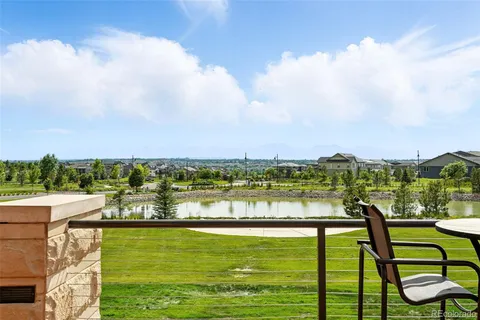a view of swimming pool with a table and chairs