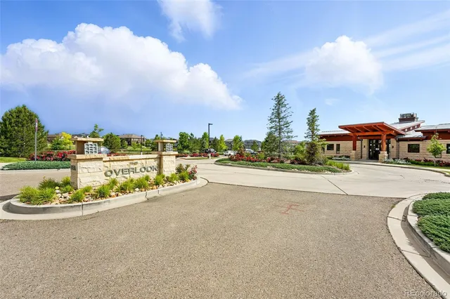 a view of a street with a houses in the back