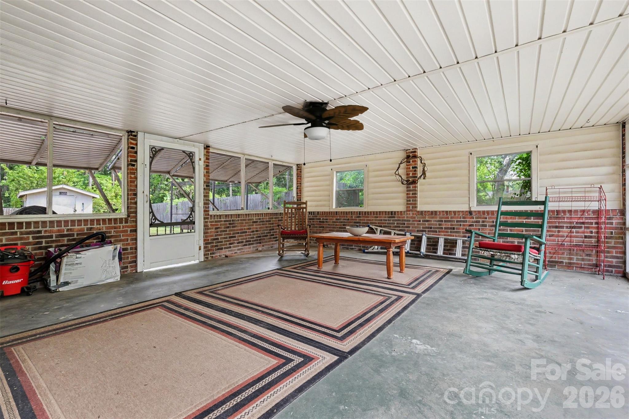 6774 Woodhaven Road Kershaw, SC 29067 - Photo 17 of 30 a living room with furniture a ceiling fan and a large window
