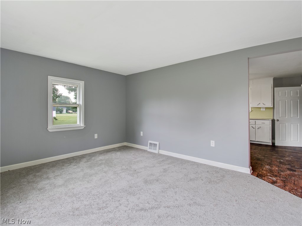 8356 South Cleveland Massillon Road Clinton, OH 44216 - Photo 21 of 30 LIVING ROOM LEADING TO KITCHEN, BEDROOMS AND BATHROOM